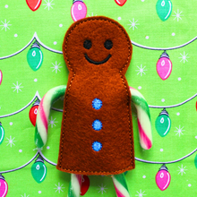 Load image into Gallery viewer, Gingerbread boy candy cane holder in brown felt with blue buttons
