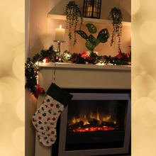 Load image into Gallery viewer, Christmas motifs stocking hanging over a fireplace