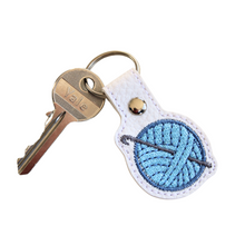 Load image into Gallery viewer, Crochet keyfob with blue wool and key