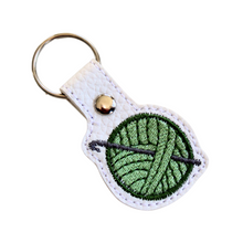 Load image into Gallery viewer, Crochet keyfob with green wool and chrome rivet and split ring