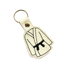 Load image into Gallery viewer, Karate keyfob with black belt on white faux leather