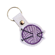 Load image into Gallery viewer, Knitting keyfob with purple yarn and chrome rivet and split ring