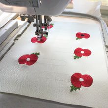 Load image into Gallery viewer, Poppy keyfob being stitched