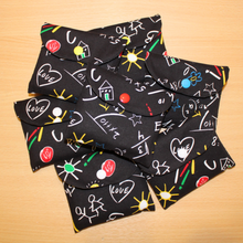 Load image into Gallery viewer, A pile of Scribble fabric pencil cases