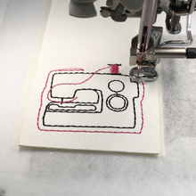 Load image into Gallery viewer, Sewing machine keyfob being stitched with pink thread