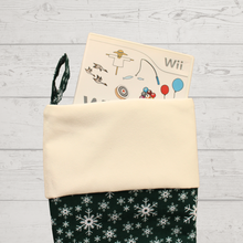 Load image into Gallery viewer, Snowflake Christmas stocking in green with a Wii game