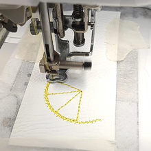 Load image into Gallery viewer, Lemon slice keyfob being stitched