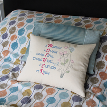 Load image into Gallery viewer, Mother Word Collage cushion on a bed with spotty bed linen in front of a blue cushion
