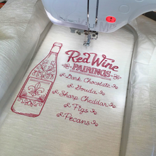 Load image into Gallery viewer, Red wine pairings cushion in embroidery frame