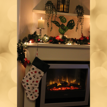 Load image into Gallery viewer, Christmas motifs stocking hanging over a fireplace
