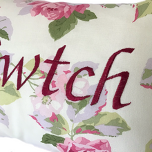 Load image into Gallery viewer, Cwtch cushion in Laura Ashley pink floral fabric close up of stitched wording
