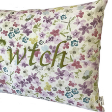 Load image into Gallery viewer, Cwtch cushion stitched in green on floral fabric in close up view
