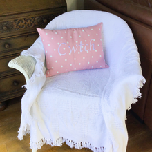 Load image into Gallery viewer, Cwtch cushion in pink and white polka dot on a chair
