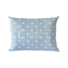 Load image into Gallery viewer, Cwtch cushion on powder blue polka dot fabric
