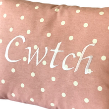 Load image into Gallery viewer, Cwtch cushion with white stitching on pink polka dot fabric
