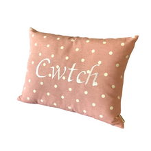Load image into Gallery viewer, Cwtch cushion with white words on pink and white polka dot fabric

