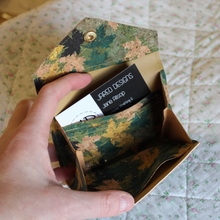 Load image into Gallery viewer, A gold leaf cork purse opened to show the credit card inserts, receipt pocket and central area for coins
