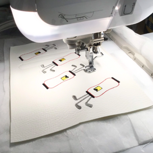 Golf bag keyfobs being stitched