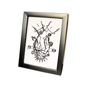 Hand Holding celestial embroidered art in a black frame