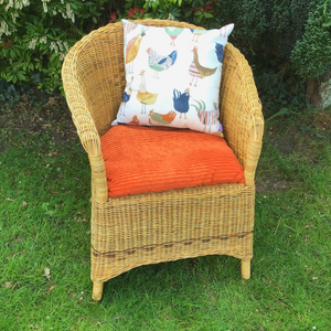 Harriet Hen cushion on wicker chair