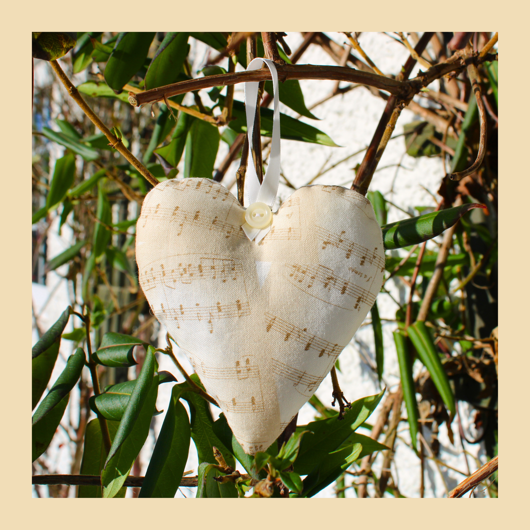 Lavender heart with musical notes fabric on a beige background