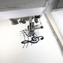 Load image into Gallery viewer, Musical notes keyfob being stitched on white faux leather
