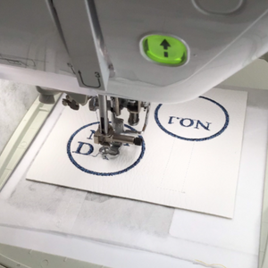No. 1 Dad keyfob being stitched