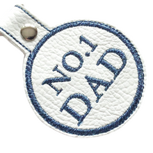 Load image into Gallery viewer, No. 1 Dad keyfob in blue thread on white faux leather
