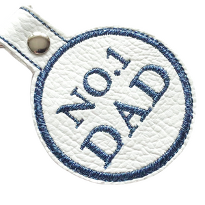 No. 1 Dad keyfob in blue thread on white faux leather