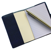 Load image into Gallery viewer, Navy notebook cover insider= flaps holding a ruled mini notebook with a pen laid across the paper
