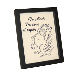 Oh Bother Pooh embroidery in a black frame