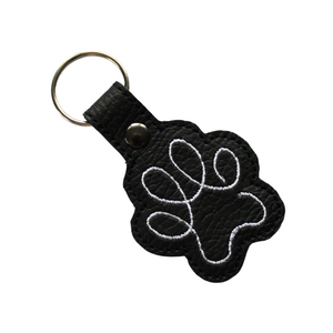 Paw print keyring in black faux leather with white stitching and metal rivet and split ring