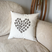 Load image into Gallery viewer, Pawprint heart cushion on a sofa
