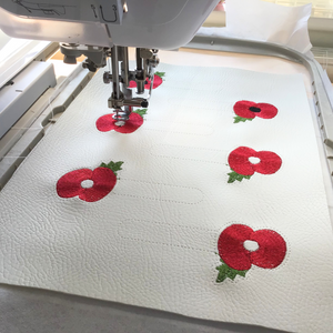 Poppy keyfob being stitched