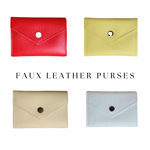 Set of four faux leather purses in red, yellow, cream and white