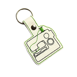 Sewing machine keyfob with green thread