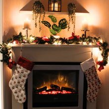 Load image into Gallery viewer, Snow globe Christmas stocking hanging from a mantlepiece
