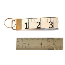 Load image into Gallery viewer, Tape measure keyfob with ruler for size comparison
