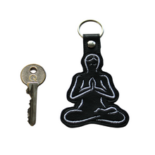 Load image into Gallery viewer, Yoga stitching in black faux leather with key for size comparison
