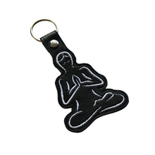 Load image into Gallery viewer, Yoga keyfob in black faux leather with white stitching
