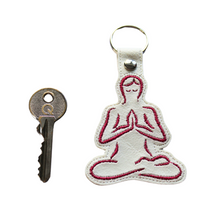 Load image into Gallery viewer, Yoga keyfob in white faux leather with a key as size comparison
