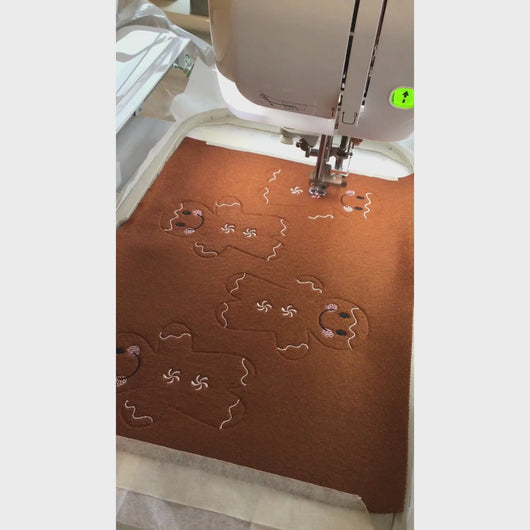 Gingerbread men being stitched