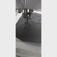 Load and play video in Gallery viewer, Pawprint keyfob being stitched on an embroidery machine
