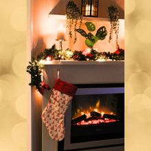 Load image into Gallery viewer, red Christmas tree stocking hanging over a fireplace
