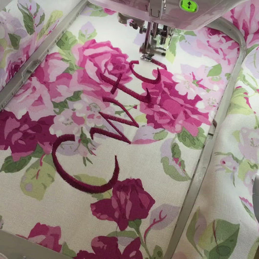 Video of the word Cwtch being embroidered onto Laura Ashley Rose fabricCwtch Cushion 