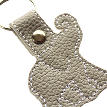 Load image into Gallery viewer, Elephant keyfob on grey faux leather close up of stitching
