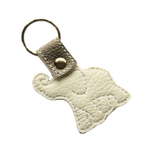 Load image into Gallery viewer, Elephant keyfob reverse on white faux leather
