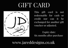 Load image into Gallery viewer, Gift Card with the Jared Designs logo on the left side of a black background and the text explaining the gift card conditions on the right side
