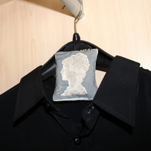 Load image into Gallery viewer, Lavender bag grey stamp on coat hanger
