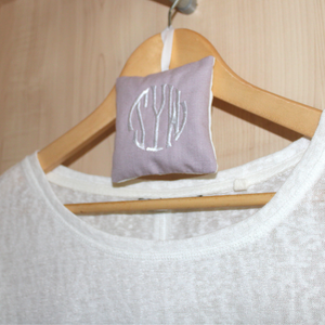 Monogram lavender bag on clothes hanger